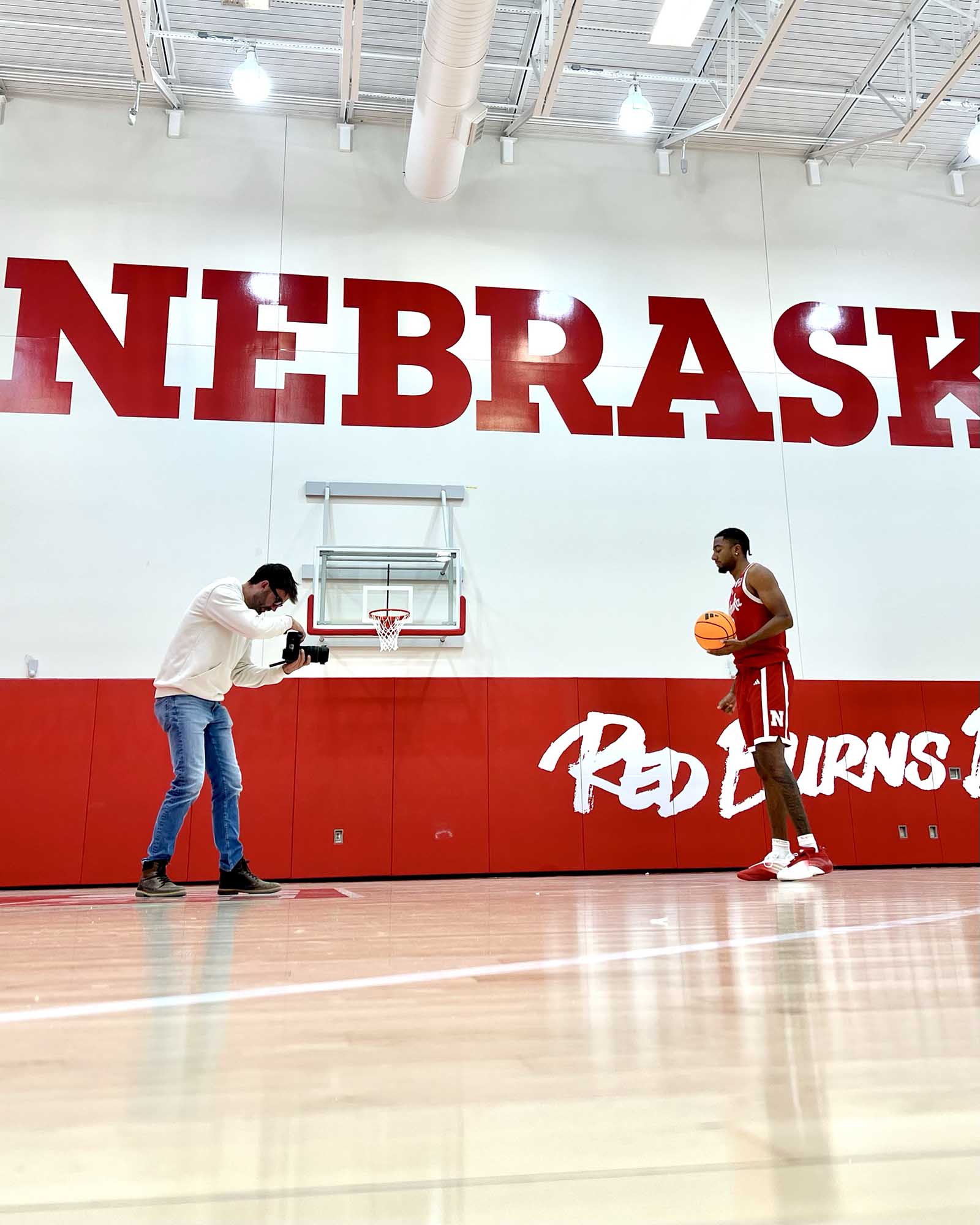 commercial photographer working with a Nebraska Men's Basketball athlete for NIL